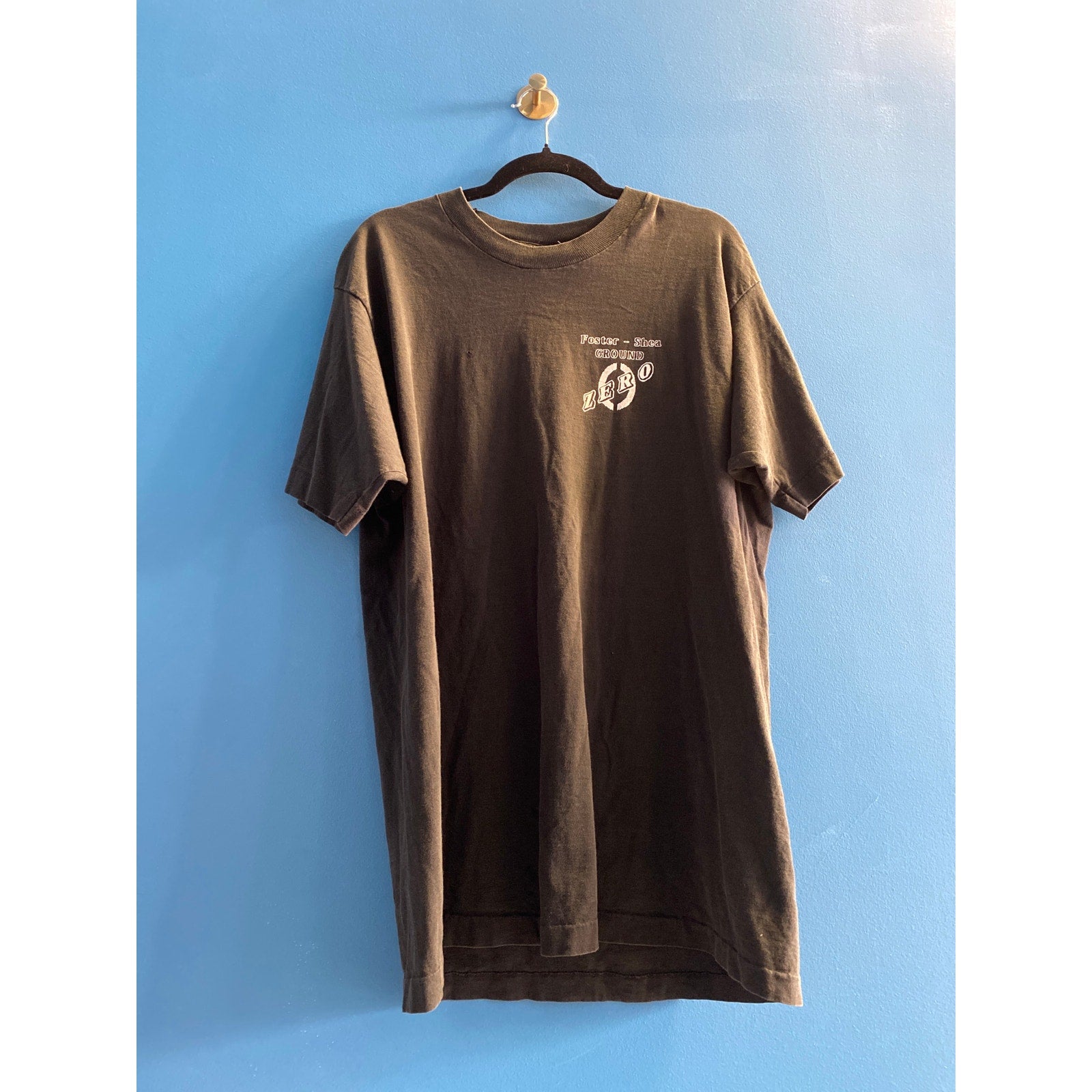 Vintage 90s Fruit of the Loom Foster-Shea Ground ZERO Black Shirt Men's Size XL?