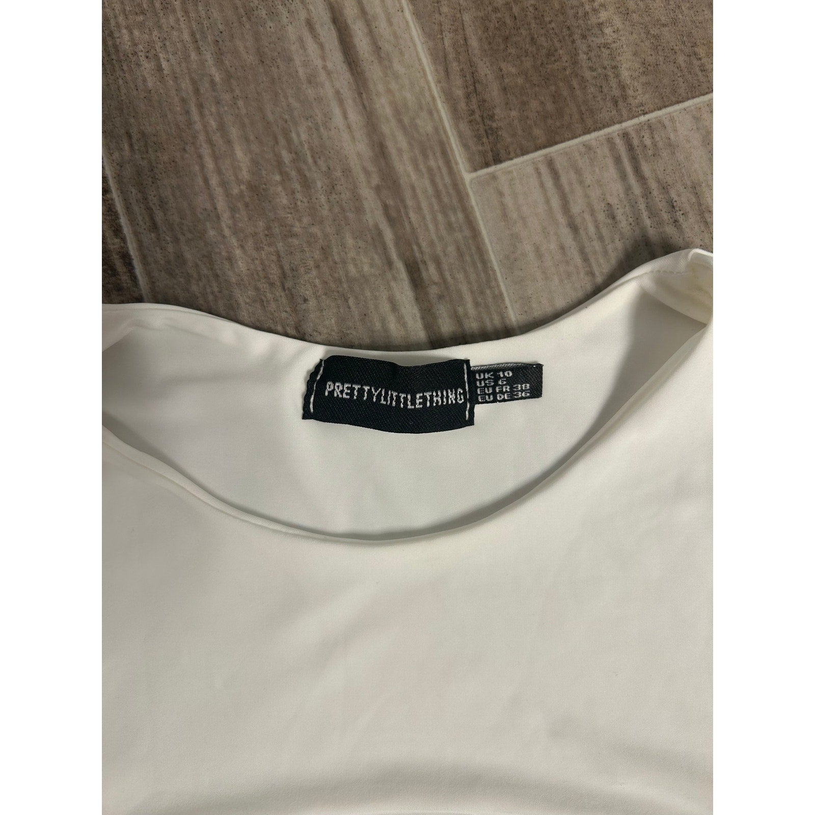 Prettylittlething White Slinky Cut Out Front Crop Top in White Sleeveless Medium